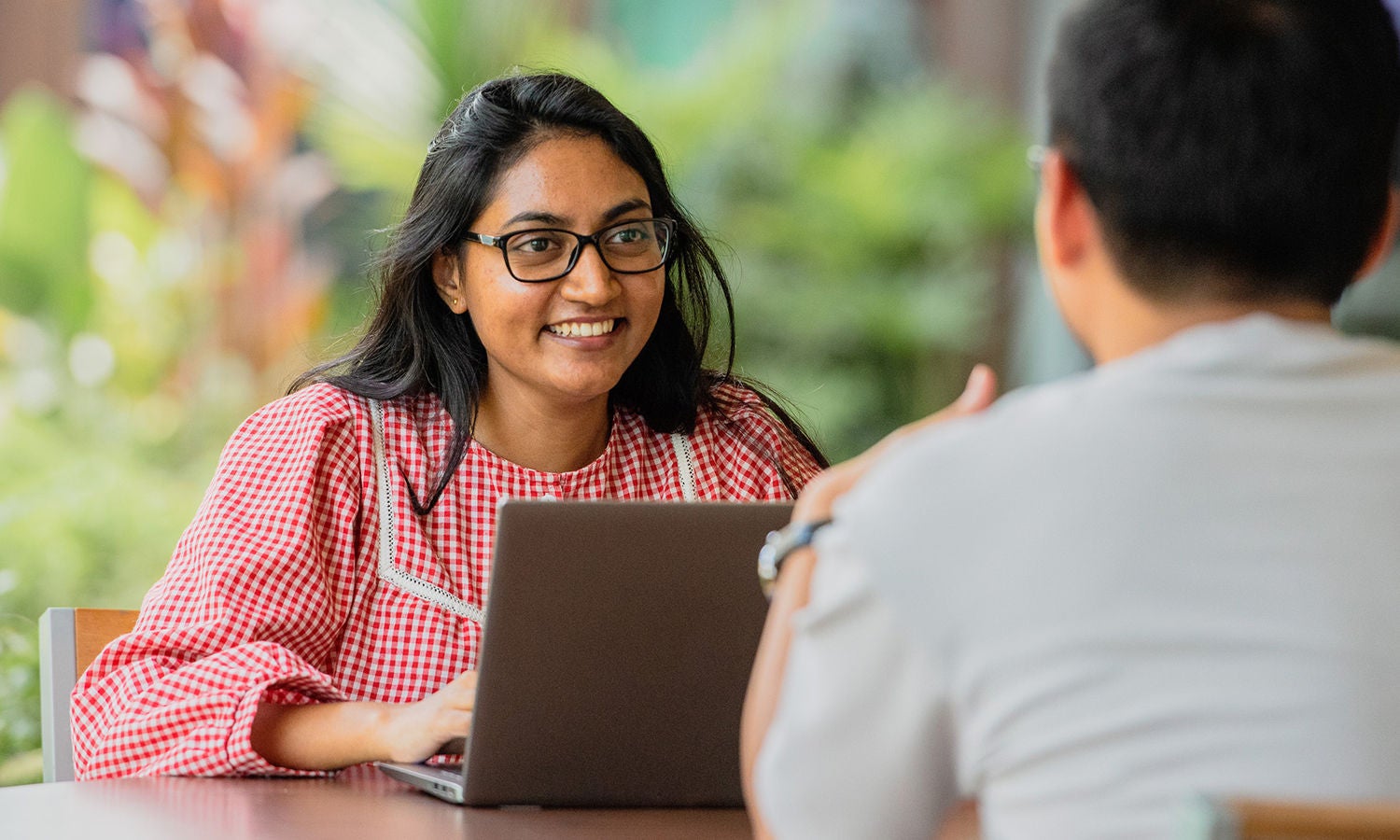 Coworkers sitting at table discussion